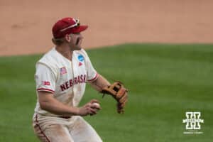 Nebraska Cornhusker Joshua Overbeek (4) waits to throw to first base during a regional baseball game against SDSU on May 29, 2026, in Lincoln, Nebraska. Photo by Brandon Tiedemann.