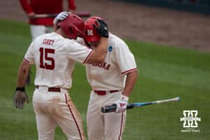 Nebraska Cornhusker Dylan Carey (15) celebrates a home run during a regional baseball game against SDSU on May 29, 2026, in Lincoln, Nebraska. Photo by Brandon Tiedemann.