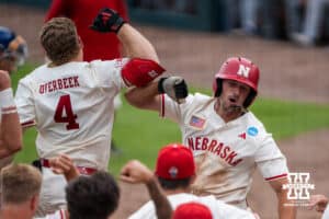 Nebraska Cornhusker Dylan Carey (15) celebrates his home run during a regional baseball game against SDSU on May 29, 2026, in Lincoln, Nebraska. Photo by Brandon Tiedemann.