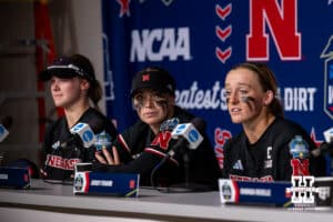 Nebraska Cornhuskers Hannah Coor (23), Ava Kuszak, and Jordy Frahm answer quesitons from the media during the WCWS first round on Thursday, May 28, 2026, in Oklahoma City. Photo by John S. Peterson.