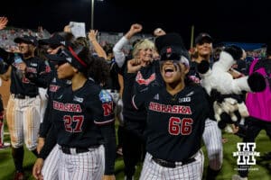 Nebraska Cornhusker Katelyn Caneda (66) celebrates the win over the Arkansas Razorbacks in the first game of the WCWS on Thursday, May 28, 2026, in Oklahoma City. Photo by John S. Peterson.