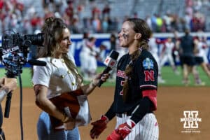 ESPN reporter Alyssa Lang interviews Nebraska Cornhusker Ava Kuszak after the Huskers win against the Arkansas Razorbacks in the first game of the WCWS on Thursday, May 28, 2026, in Oklahoma City. Photo by John S. Peterson.