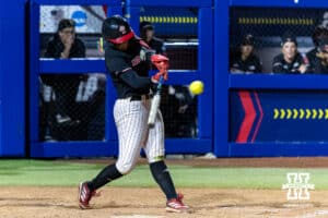 Nebraska Cornhusker Ava Kuszak hits a two-run walk-off home run Arkansas Razorbacks in the first round of the WCWS on Thursday, May 28, 2026, in Oklahoma City. Photo by John S. Peterson.