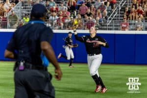 Nebraska Cornhusker outfielder Kacie Hoffmann (14) makes a catch for an out against the Arkansas Razorbacks in the ninth inning during the WCWS first round on Thursday, May 28, 2026, in Oklahoma City. Photo by John S. Peterson.