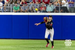 Nebraska Cornhusker outfielder Hannah Coor (23) makes a catch for an out against the Arkansas Razorbacks in the ninth innings during the WCWS first round on Thursday, May 28, 2026, in Oklahoma City. Photo by John S. Peterson.