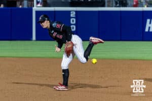 Nebraska Cornhusker infielder Lauren Camenzind (2) missess fielding a ball against the Arkansas Razorbacks seventh inning during the WCWS first round on Thursday, May 28, 2026, in Oklahoma City. Photo by John S. Peterson.