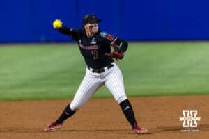 Nebraska Cornhusker infielder Ava Kuszak (7) throws to first in the second inning against the Arkansas Razorbacks during the WCWS first round on Thursday, May 28, 2026, in Oklahoma City. Photo by John S. Peterson.