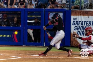 Nebraska Cornhusker Jordy Frahm (98) hits a single in the first inning against the Arkansas Razorbacks during the WCWS first round on Thursday, May 28, 2026, in Oklahoma City. Photo by John S. Peterson.