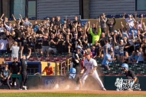Elkhorn North’s Flynn Fickbohm (24) sliding into home base to tie up the game during a Nebraska baseball Class B state championship game against Skutt Catholic on Saturday, May 23, 2026, in Omaha, Neb. Photo by Jandi Green.
