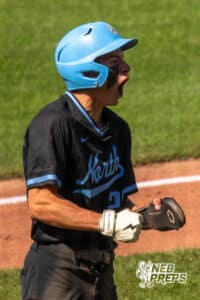 Elkhorn North’s Flynn Fickbohm (24) is celebrating after scoring during a Nebraska baseball Class B state championship game against Skutt Catholic on Saturday, May 23, 2026, in Omaha, Neb. Photo by Jandi Green.