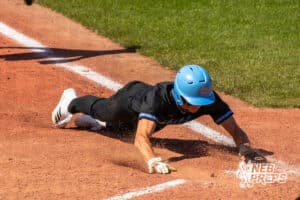 Elkhorn North’s Flynn Fickbohm (24) sliding into home base during a Nebraska baseball Class B state championship game against Skutt Catholic on Saturday, May 23, 2026, in Omaha, Neb. Photo by Jandi Green.