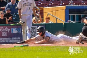 Skutt Catholic's Bubba Day (17) sliding into home base during a Nebraska baseball Class B state championship game against Elkhorn North on Saturday, May 23, 2026, in Omaha, Neb. Photo by Jandi Green.