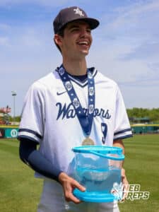 Lincoln Lutheran's Braxton Glines (9) holding their fish after winning a Nebraska baseball Class C state championship game against Mount Michael Benedictine on Saturday, May 23, 2026, in Omaha, Neb. Photo by Jandi Green.