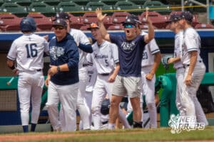 Lincoln Lutheran’s celebrating after scoring a run during a Nebraska baseball Class C state championship game against Mount Michael Benedictine on Saturday, May 23, 2026, in Omaha, Neb. Photo by Jandi Green.