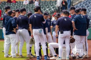 Lincoln Lutheran’s group meeting before a Nebraska baseball Class C state championship game against Mount Michael Benedictine on Saturday, May 23, 2026, in Omaha, Neb. Photo by Jandi Green.