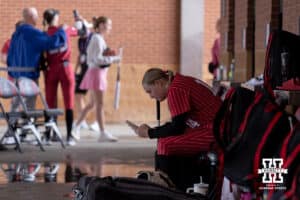 Nebraska Cornhusker outfielder Kacie Hoffmann (14) checking her phone during the WCWS softball media day on Wednesday, May 27, 2026, in Oklahoma City. Photo by John S. Peterson.