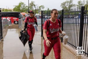 Nebraska Cornhusker Ava Kuszak (7) and Jordyn Frahm arrive at Devon Park Stadium during the WCWS softball media day on Wednesday, May 27, 2026, in Oklahoma City. Photo by John S. Peterson.
