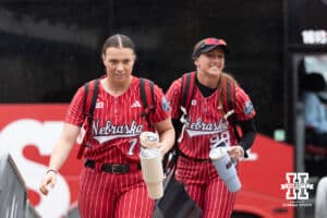 Nebraska Cornhusker Ava Kuszak (7) and Jordyn Frahm arrive at Devon Park Stadium during the WCWS softball media day on Wednesday, May 27, 2026, in Oklahoma City. Photo by John S. Peterson.