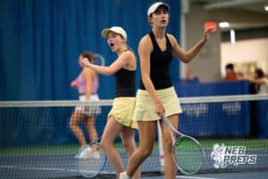 Lincoln Southeast teammates Clio Baird and Elizabeth Sidders celebrate a point against Omaha Marian during a state tennis tournament, Friday, May. 22, 2026, Lincoln, Nebraska. Photo by Braden Cochran.
