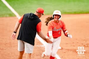 Oklahoma State Cowgirl Karli Godwin (14) celebrates with head coach Kenny Gajewski after her homerun during a softball game at Rhonda Revelle Field at Bowlin Stadium on Friday, May 22, 2026 in Lincoln, Neb. Photo by Collin Stilen.