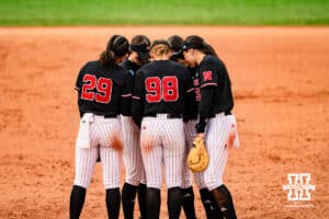 Nebraska Cornhuskers gather during a softball game at Rhonda Revelle Field at Bowlin Stadium on Friday, May 22, 2026 in Lincoln, Neb. Photo by Collin Stilen.