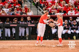 Oklahoma State Cowgirl Ruby Meylan (66) talks it through with her teammate during a softball game at Rhonda Revelle Field at Bowlin Stadium on Friday, May 22, 2026 in Lincoln, Neb. Photo by Collin Stilen.