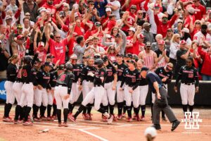 Nebraska Cornhuskers celebrate at the plate after Jesse Farrell (25) hits a homerun in the first inning during a softball game at Rhonda Revelle Field at Bowlin Stadium on Friday, May 22, 2026 in Lincoln, Neb. Photo by Collin Stilen.