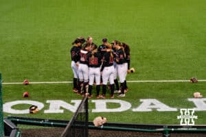 Nebraska Cornhuskers gather around for a pregame talk during a softball game at Rhonda Revelle Field at Bowlin Stadium on Thursday, May 21, 2026 in Lincoln, Neb. Photo by Collin Stilen.