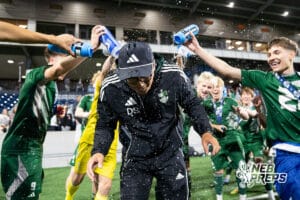 Lincoln Southwest head coach Derek Scheich showered in water after victory during the 2026 Class A Boys State Soccer Championship match against Omaha South Tuesday, May 20, 2025, in Omaha, Nebraska. Photo by Jackson D. Luethje.