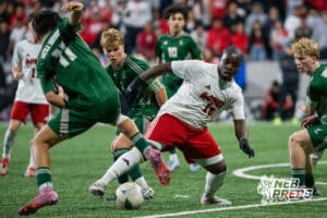 Omaha South's's Ryan Kubiak (16) swarmed by Lincoln Southwest defenders during the 2026 Class A Boys State Soccer Championship match Wednesday, May 20, 2026, in Omaha, Nebraska. Photo by Jackson D. Luethje.