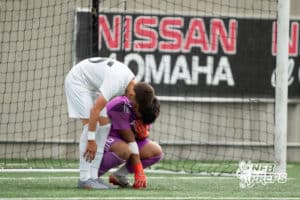 Lexington's Alexis Alvidrez-Cardiel (0) comforted by Luis Gomez-Leal (25) during the 2026 Class B Boys State Soccer Championship match Wednesday, May 20, 2026, in Omaha, Nebraska. Photo by Jackson D. Luethje.