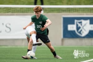 Gretna's Brady Cerone (20) defended by Lexington's Juan Raymundo-Jesus (12) during the 2026 Class B Boys State Soccer Championship match Wednesday, May 20, 2026, in Omaha, Nebraska. Photo by Jackson D. Luethje.