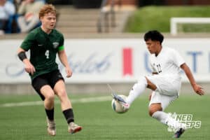 Lexington's Miguel Tercero-Pascual (22) defended by Gretna's Evan Lafferty (4) during the 2026 Class B Boys State Soccer Championship match Wednesday, May 20, 2026, in Omaha, Nebraska. Photo by Jackson D. Luethje.