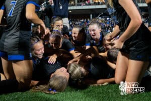 Omaha Marian dog-piles in celebration during the 2026 Class A Girls State Soccer Championship match against Elhorn South Tuesday, May 19, 2026, in Omaha, Nebraska. Photo by Jackson D. Luethje.