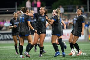 Omaha Marian's Cooper Dally (18) celebrates goal with Mya Sennett (17) during the 2026 Class A Girls State Soccer Championship match against Elkhorn South Tuesday, May 19, 2026, in Omaha, Nebraska. Photo by Jackson D. Luethje.