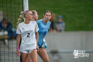 Elkhorn South's Alaina Brown (2) blocks Omaha Marian's Hayden Blaney (0) view from a corner kick during the 2026 Class A Girls State Soccer Championship match Tuesday, May 19, 2026, in Omaha, Nebraska. Photo by Jackson D. Luethje.