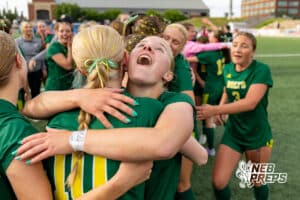 Lincoln Pius X’s Josie McCabe (28) and Chloe Kolm (10) are embracing each other after winning the NSAA Class B Girls State Championship game against Blair on Tuesday, May 19, 2026 in Omaha, Nebraska. Photo By Jack Stephens
