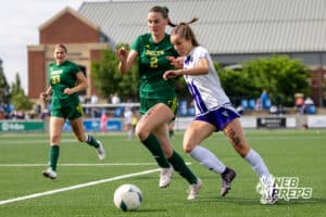 Blair’s Cadence Field (7) is dribbling the ball through the contact of Lincoln Pius X’s Georgia Wright (2) during the NSAA Class B Girls State Championship game on Tuesday, May 19, 2026 in Omaha, Nebraska. Photo By Jack Stephens