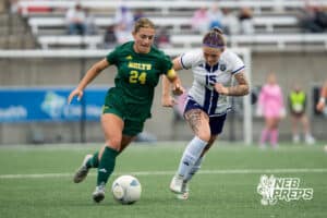 Lincoln Pius X's Cammie Hodge (25) defneded by Blair’s Emmi Hall (15) during the 2026 Class B Girls State Soccer Championship match Tuesday, May 19, 2026, in Omaha, Nebraska. Photo by Jackson D. Luethje.