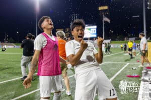 Lexington’s Mario Maravilla (10) and Juan Raymundo-Jesus (12) are celebrating after winning a high school state soccer game against Schuyler on Saturday, May 16, 2026, in Omaha, Nebraska. Photo By Jack Stephens.