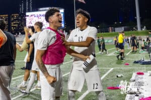 Lexington’s Mario Maravilla (10) and Juan Raymundo-Jesus (12) are celebrating after winning a high school state soccer game against Schuyler on Saturday, May 16, 2026, in Omaha, Nebraska. Photo By Jack Stephens.