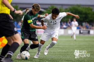 Schuyler’s David Arciga (11) and Lexington’s Juan Raymundo-Jesus (12) are fighting for possession of the ball during a high school state soccer game on Saturday, May 16, 2026, in Omaha, Nebraska. Photo By Jack Stephens.