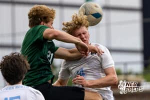 Elkhorn North’s Kason Krings (14) is hitting the ball with his head against Gretna during a NSAA Class B semi-finals soccer match on Saturday, May 16, 2026, in Omaha, Nebraska. Photo By Jack Stephens.