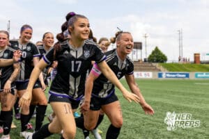 Blair’s Lainey Smoyer (17) and Claire Anderson (5) are running to the crowd after winning a high school state soccer game against Skutt Catholic during a NSAA Class B semi-finals soccer match on Saturday, May 16, 2026, in Omaha, Nebraska. Photo By Jack Stephens.