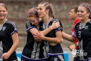 Blair’s Abbi Vainer (12) and Cadence Field (7) are hugging each other after Field scored her second goal of the day for the Bears against Skutt Catholic during a NSAA Class B semi-finals soccer match on Saturday, May 16, 2026, in Omaha, Nebraska. Photo By Jack Stephens.