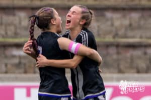 Blair’s Kaitlynn O’Neil (3) and Cadence Field (7) are embracing each other after O’Neil scored a goal against Skutt Catholic during a NSAA Class B semi-finals soccer match on Saturday, May 16, 2026, in Omaha, Nebraska. Photo By Jack Stephens.