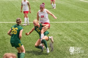 Elkhorn Antler Kat Rodgers 24 tangles up with Lincoln Pius X Thunderbolt Ava Kolm 14 during a girls state soccer match at Morrison Stadium on May 16th, 2026, in Omaha, Nebraska. Photo by Dawson Anderson.