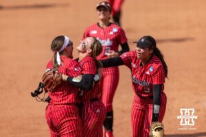 Nebraska Cornhusker Alexis Jensen (99) hugs Jordy Frahm (98) after the win over the Grand Canyon Antelope during the NCAA Softball Regionals on Sunday, May 17, 2026, in Lincoln, Neb. Photo by John S. Peterson.