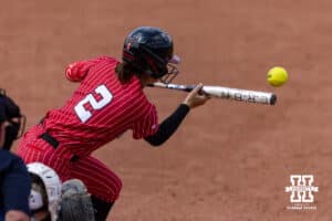 Nebraska Cornhusker infielder Lauren Camenzind (2) drops a bunt in the fifth against the Grand Canyon Antelope against the Grand Canyon Antelope during the NCAA Softball Regionals on Sunday, May 17, 2026, in Lincoln, Neb. Photo by John S. Peterson.
