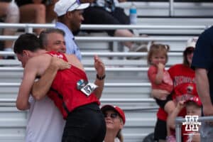 Nebraska Cornhusker Dyson Wicker hugs someone during the Big Ten OTF Championships on May 17, 2026, in Lincoln, Nebraska. Photo by Brandon Tiedemann.